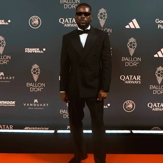 Adekunle Gold Shines On 70th Ballon D’Or Red Carpet 
